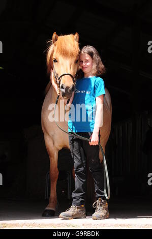 Icelandic Horse with girl, bridle Stock Photo