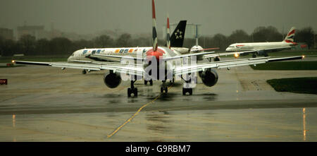 Aircraft queue in the train for a take-off slot at London's Heathrow Airport. PRESS ASSOCIATION Photo. Stock Photo