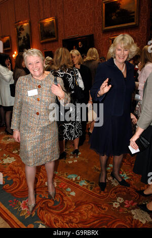 The Duchess of Cornwall (l) meets Mrs Dianne Thompson of the Camelot Group PLC at a Women in Business Reception at Buckingham Palace today, Valentine's Day. Stock Photo