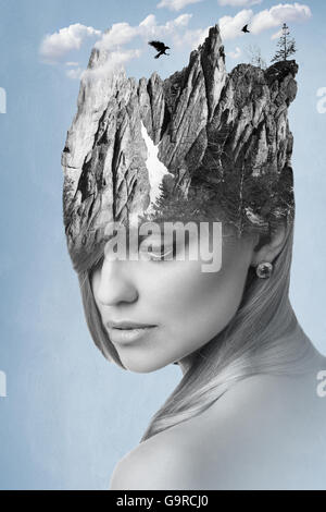 Woman combined with mountains on her head Stock Photo