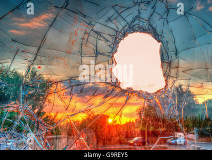 Broken glass by the street at sunset Stock Photo