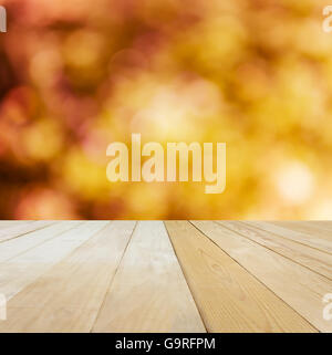 Blank area or space table top on bokeh orange and yellow spring summer mood nature background, jointed wood table top for puttin Stock Photo