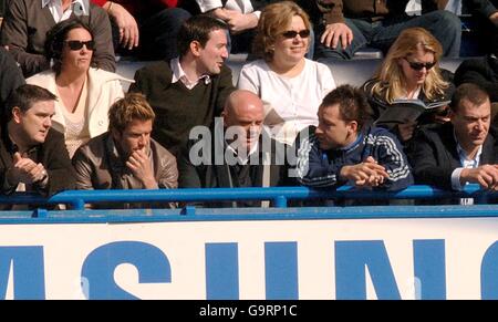 Soccer - FA Cup - Sixth Round - Chelsea v Tottenham Hotspur - Stamford Bridge. Real Madrid's David Beckham (second left) and Chelsea's John Terry (second right) watch the match from the stands Stock Photo