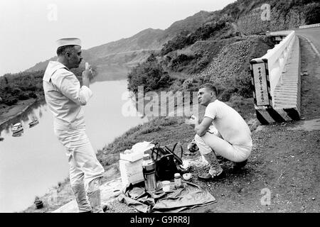 Richard Attenborough and Steve McQueen enjoying a picnic lunch of the banks of the Tam Sui River in Formosa, during filming of the the film 'The Sand Pebbles'. 21/3/1966 Stock Photo