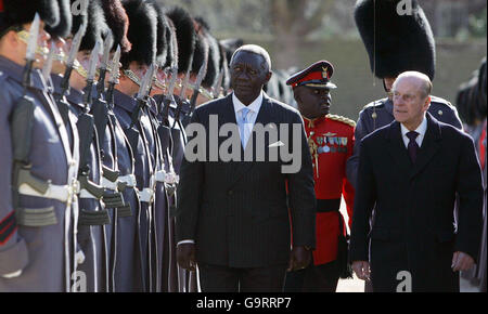 President of Ghana John Kufuor is escorted by the Duke of Edinburgh as he inspects the Guard of Honour during the Ceremonial Welcome at Horse Guards in London. Stock Photo