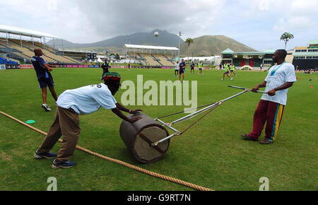 Cricket - ICC Cricket World Cup 2007 - Scotland training/press conference - Warner Park. Ground staff prepare the pitch while Scotland's players warm up with a football game during a nets session at Warner Park, St Kitts. Stock Photo