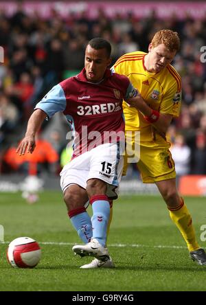 Aston Villa's Gabriel Agbonlahor and Liverpool's John Arne Riise (right) Stock Photo