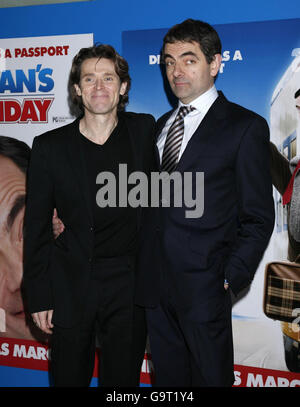 The stars of the film Willem Dafoe (Left) and Rowan Atkinson arrive for the UK Charity Premiere of Mr Bean's Holiday at The Odeon in central London. Stock Photo