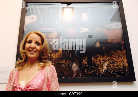 Gillian McKeith stands next to her portrait depicting her childhood dream of 'being a vet', at the 'When I Grow Up' photographic exhibition - held by the Children's Society - in central London. Stock Photo