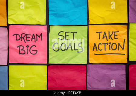 dream big, set goals, take action - motivational advice or reminder on colorful sticky notes Stock Photo