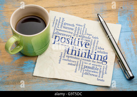 positive thinking word cloud - handwriting on a napkin with a cup of espresso coffee Stock Photo