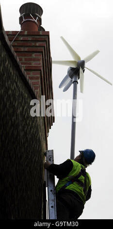 A workman errects the new wind turbine on Conservative Leader David Cameron's new house in West London. Stock Photo