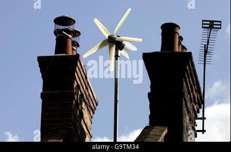 Budget 2007. A workman errects the new wind turbine on Conservative Leader David Cameron's new house in West London. Stock Photo