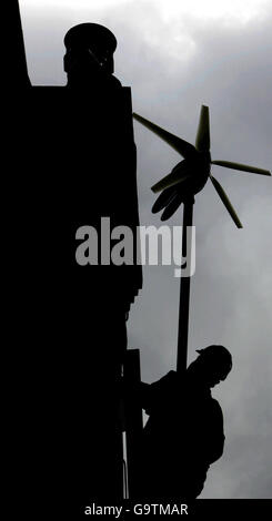 A workman errects the new wind turbine on Conservative Leader David Cameron's new house in West London. Stock Photo