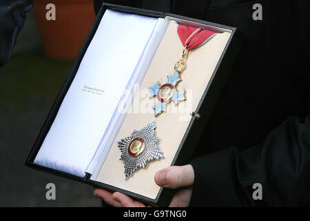 Bono shows off his honorary knighthood outside the British ambassador's official residence in Sandyford, Dublin. Stock Photo