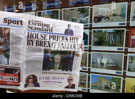 'House Prices Hit By Brexit Fallout' newspaper headline outside London estate agents Stock Photo