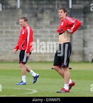 Liverpool's Daniel Agger (right) and Craig Bellamy during a training session at Melwood training ground, Liverpool. Stock Photo