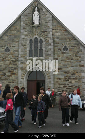 Parishoners leave St Patricks church in Mongeer, Co Wexford, where prayers were said for the Dunne family whose bodies were found in the family home in the village yesterday. Stock Photo