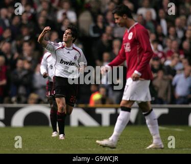 AC Milan's Ricardo Kaka (l) celebrates after scoring the equaliser as Manchester United's Cristiano Ronaldo looks dejected Stock Photo