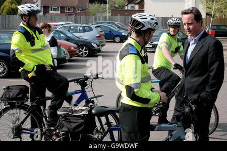 Conservative Party leader David Cameron talks to police community support officers on a walkabout in Wolverhampton, while out on the local election campaign trail. Stock Photo