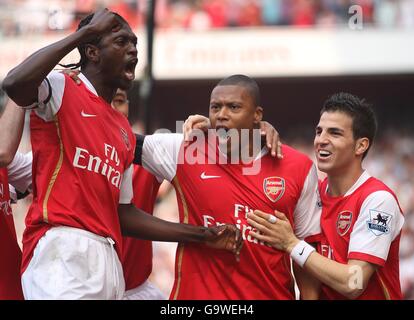 Arsenal's Cesar Julio Baptista (c) celebrates after scoring the opening goal of the match with team mates Emmanuel Adebayor (l) and Francesc Fabregas (r) Stock Photo