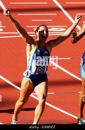 Ukraine's Zhanna Pintusevich-Block celebrates as she crosses the finsh line to win the final of the Womens 100 metres over favourite Marion Jones. Stock Photo