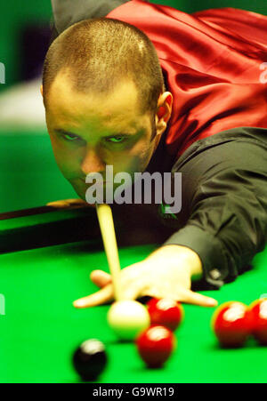 Scotland's Stephen Maguire in action against Scotland's John Higgins during the semi-final match at the World Snooker Championships at the Crucible Theatre, Sheffield. Stock Photo