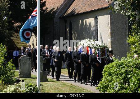 The coffin is carried from St Andrews Church in Tangmere near Chichester West Sussex after the funeral of Neville Duke, test pilot and World War II fighter ace. Stock Photo