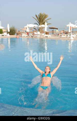 Young woman jumping backwards, Hurghada, Egypt, Africa Stock Photo