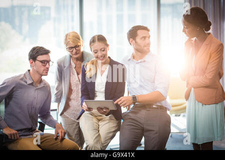Business people interacting using digital tablet Stock Photo