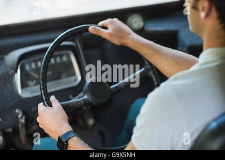 Bus driver driving a bus Stock Photo