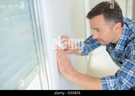 fitting a new light switch Stock Photo