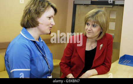 Health Secretary Nicola Sturgeon (right) chats with ward manager Emma Henderson at Beatson West of Scotland Cancer Centre in Glasgow. Stock Photo