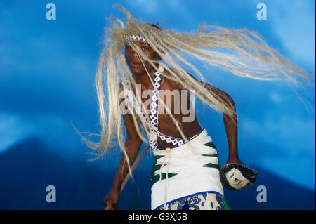 Local Intore dancer with straw headdress. Volcanoes National Park, Vinguas, Rwanda. February 2012. Stock Photo