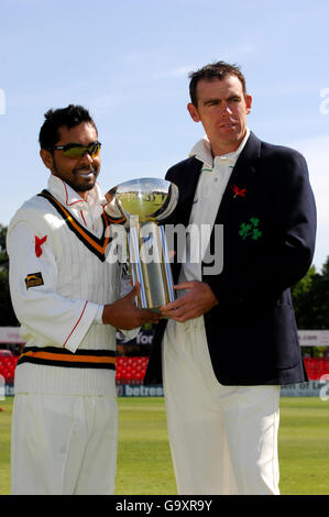 Canada's captain Ashish Bagai, and Ireland's captain Trent Johnston with the ICC Intercontinental Cup before the ICC Intercontintental Cup Final at Grace Road, Leicester. Stock Photo