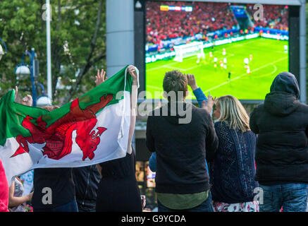 Castle Square, Swansea, UK. 1st July, 2016. Fans watching Euro 2016 quarter finals just after Wales 2nd goal. Nikki Courtnage/Alamy Live News Stock Photo