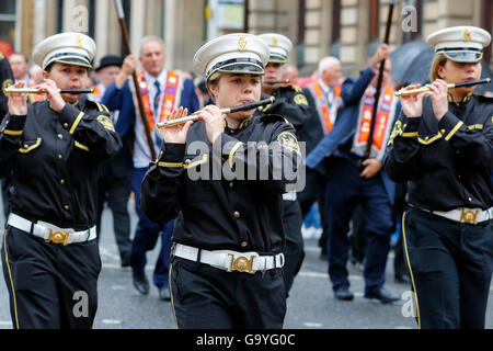 Glasgow, Scotland, UK. 02nd July, 2016. More than 50 Flute Bands from across the United Kingdom paraded through Glasgow city centre in preparation for the annual  12 July 'Battle of the Boyne' celebrations, an significant date in the Loyal Orange Lodge calendar. Despite strong winds and heavy rain, many Orange Lodge supporters lined the streets. Credit:  Findlay/Alamy Live News Stock Photo