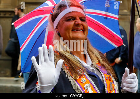 Glasgow, Scotland, UK. 02nd July, 2016. More than 50 Flute Bands from across the United Kingdom paraded through Glasgow city centre in preparation for the annual  12 July 'Battle of the Boyne' celebrations, an significant date in the Loyal Orange Lodge calendar. Despite strong winds and heavy rain, many Orange Lodge supporters lined the streets. Credit:  Findlay/Alamy Live News Stock Photo