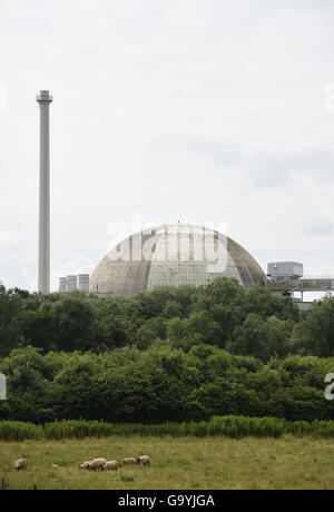 Esensham, Germany. 4th July, 2016. The Unterweser nuclear power plant surrounded by trees, near Esensham, Germany, 4 July 2016. Eon is demanding damages due to the temporary shut down of the Isar 1 and Unterweser nuclear power stations ordered by the states of Bavaria and Lower Saxony in March 2011. The verdict is due to be announced at Hanover regional court on 4 July 2016. PHOTO: CARMEN JASPERSEN/DPA/Alamy Live News Stock Photo