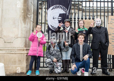 Belfast, UK, Europe. 4th July 2016. Anonymous protesters stage a rally at the gates of Belfast City hall. Credit:  Bonzo/Alamy Live News Stock Photo