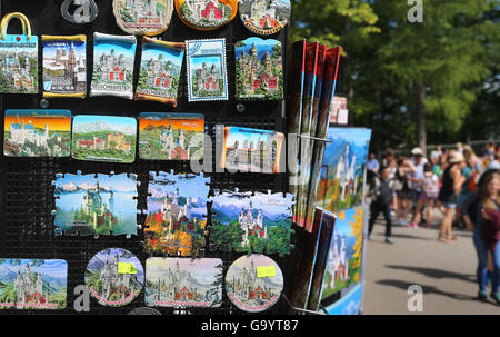 Magnets with pictures of Neuschwanstein Castle can be seen at a souvenir shop below Neuschwanstein Castle near Fuessen, Germany, 05 July 2016. On 05 July 2016, the EU court in Luxemburg will pass judgement in the fight over the 'Neuschwanstein' trademark. In 2011, the state of Bavaria had already had the name of Ludwig II's fairy-tale castle protected as a trademark for, among other things, perfumes, knives, music boxes, telecommunications lines, and beauty products. The Souvenir, Gifts, Prizes Federation (BSGE) is taking action. Photo: KARL-JOSEF HOLDENBRAND/dpa Stock Photo