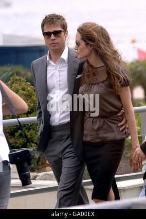 Brad Pitt and Angelina Jolie arrive for a photocall for her new film, 'A Mighty Heart' during the 60th annual Cannes Film Festival in Cannes, France. Stock Photo