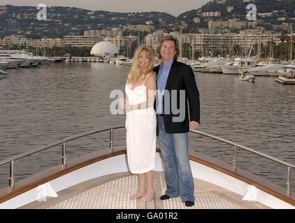 Goldie Hawn and Kurt Russell on a boat in Cannes to promote the film Ashes to Ashes which Hawn has co-written and will direct and star in with Russell. Stock Photo