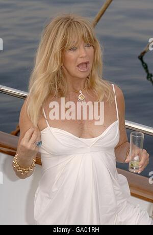 Goldie Hawn and Kurt Russell on a boat in Cannes to promote the film Ashes to Ashes which Hawnm has co-written and will direct and star in with Russell. Stock Photo