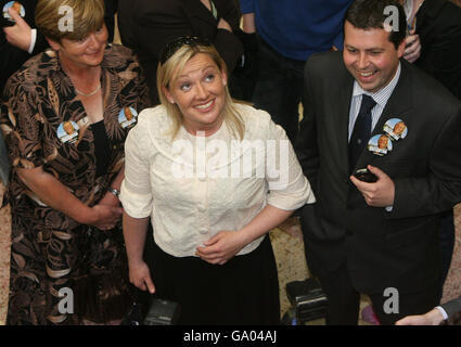 Fine Gael candidate Lucinda Creighton (centre) looks up at party members as counting begins in the Irish General election at the RDS in Dublin. Stock Photo