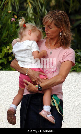 Kate McCann carries daughter Amelie as she and husband Gerry take their children to the creche in Praia Da Luz, Portugal. Stock Photo