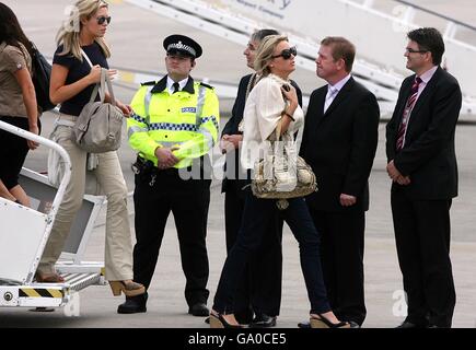 Alex Curran (right) Fiance of Liverpool's Steven Gerrard and Abigail Clancy Girlfriend of Liverpool's Peter Crouch arrives at Liverpool John Lennon Airpor Stock Photo