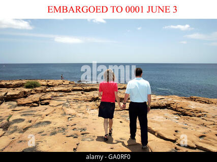 Kate and Gerry McCann sit on the sea front in Praia da Luz, Portugal. Stock Photo