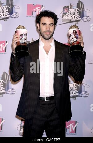 Sacha Baron Cohen with his two awards for Best Kiss received for Talladega Nights: The Ballad of Ricky Bobby and Best Comedic Performance received for Borat: Cultural Learnings of America for Make Benefit Glorious Nation of Kazakhstan, at the 2007 MTV Movie awards at the Gibson Amphitheatre, Universal City, Los Angeles. Stock Photo