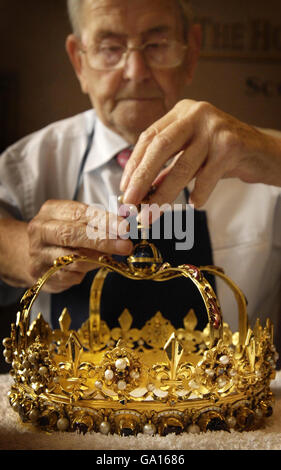 Previously unreleased photo dated 18/06/2007 of Bill Jameson cleaning the Scottish crown at Edinburgh castle ahead of the opening of the Scottish Parliament. Stock Photo
